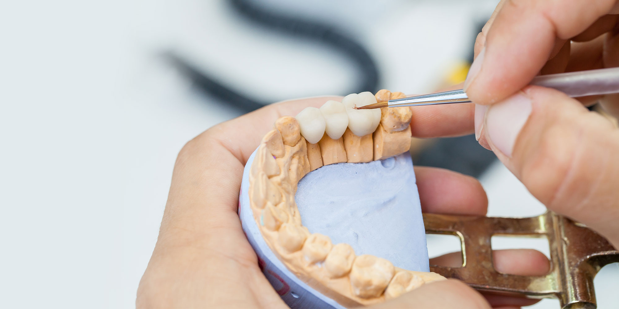 dental technician working on a dental bridge