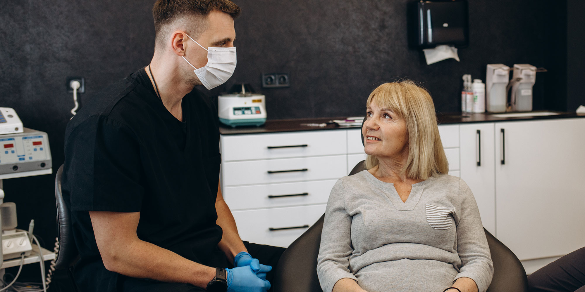 dental patient sitting in exam chair